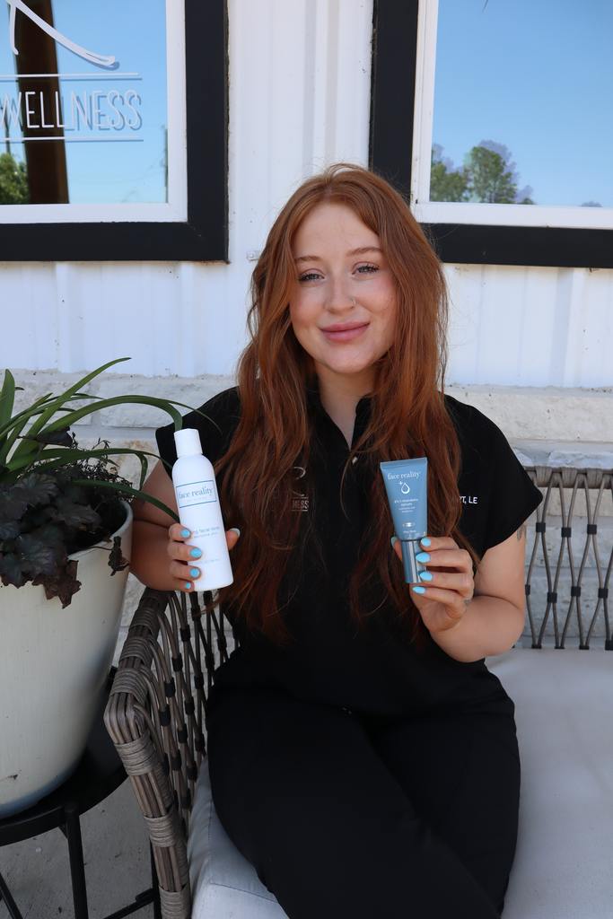 Woman holding up chemical peel products